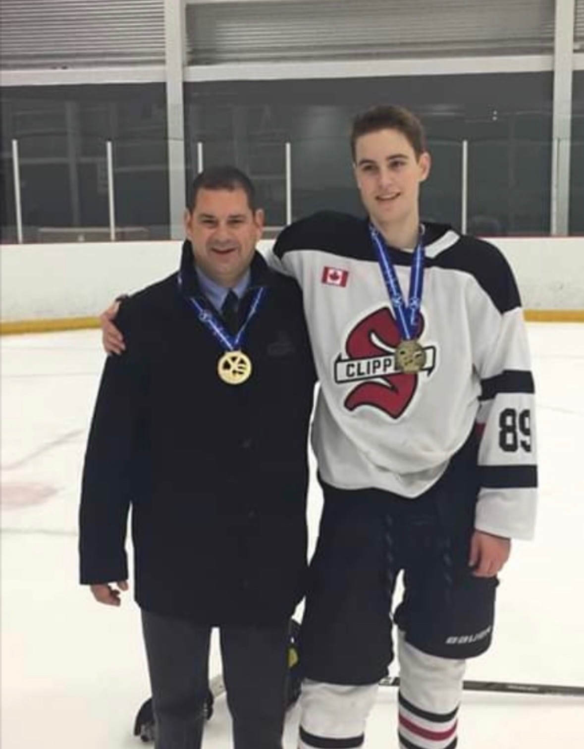 Greg with a championship-winning Stouffville Clippers player